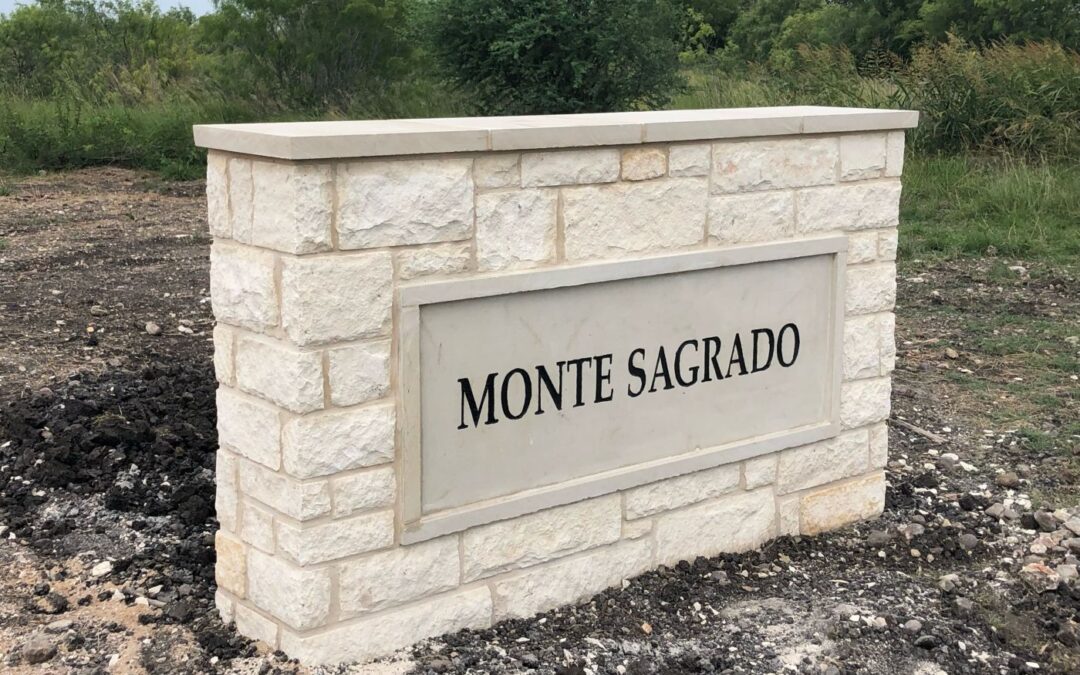 a simple monument neighborhood entrance sign for Monte Sagrado near Austin, TX